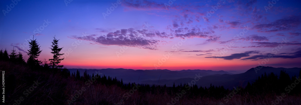 Colorful skyline over the mountains in early morning before sunrise
