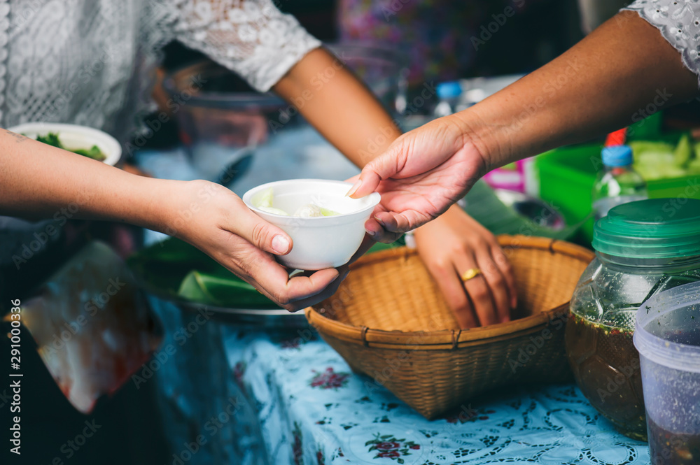 Volunteers serving food for poor people : concept of free food serving Volunteers serving food for poor people : concept of free food serving