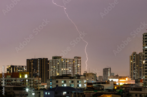 Cityscape of residential building with lightning at night