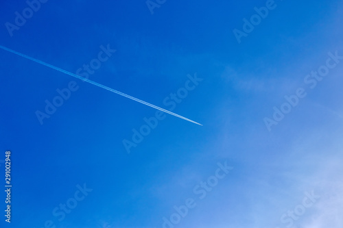 An airplane flying in the blue sky