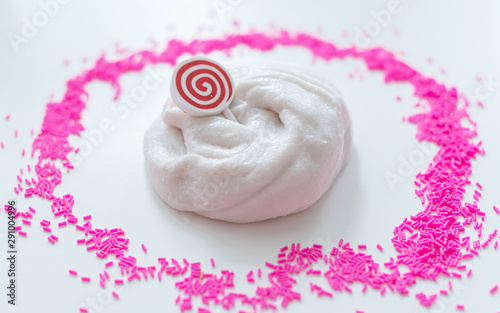 hand made toy called slime. white slime and pink sprinkles. 