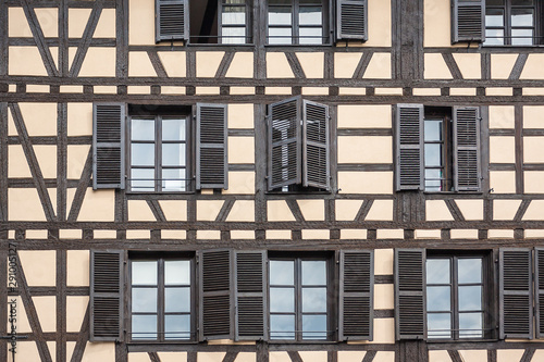 Facade of a building with windows in the historic district  Petite France  in Strasbourg  Alsace  France