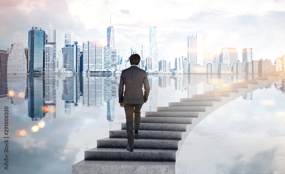 Businessman climbing stairs in city Businessman climbing stairs in city