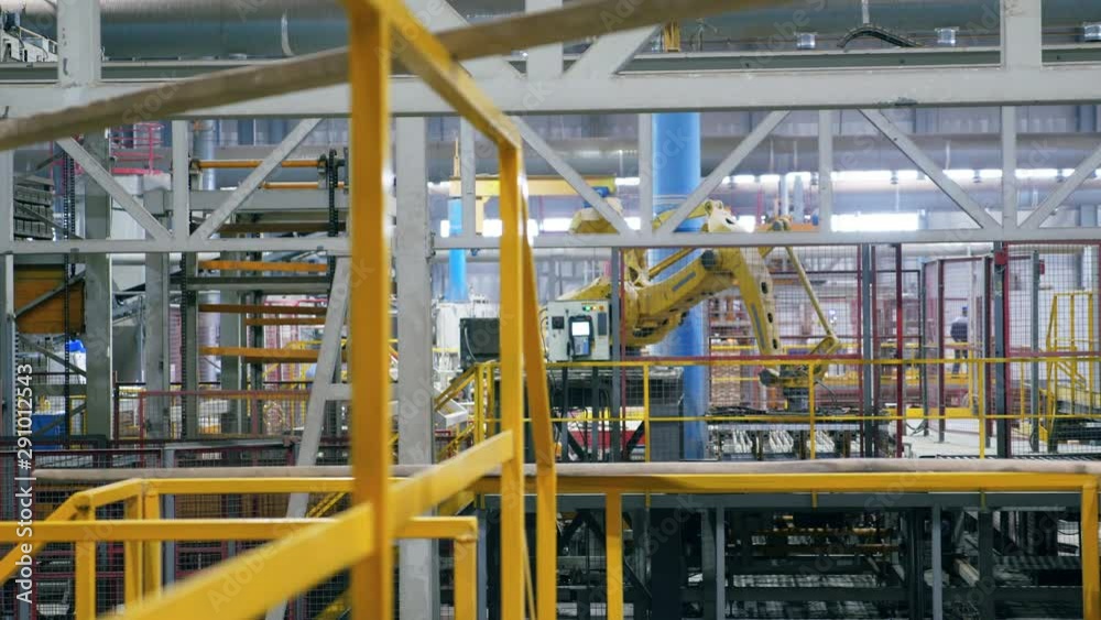 Robotic arm moving many bricks at a plant. Robotic arm moving many bricks at a plant.