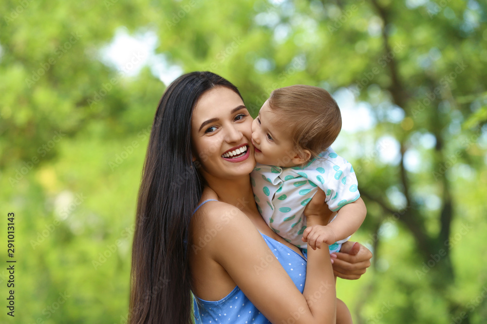 Beautiful mother with her cute baby in park on summer day Beautiful mother with her cute baby in park on summer day