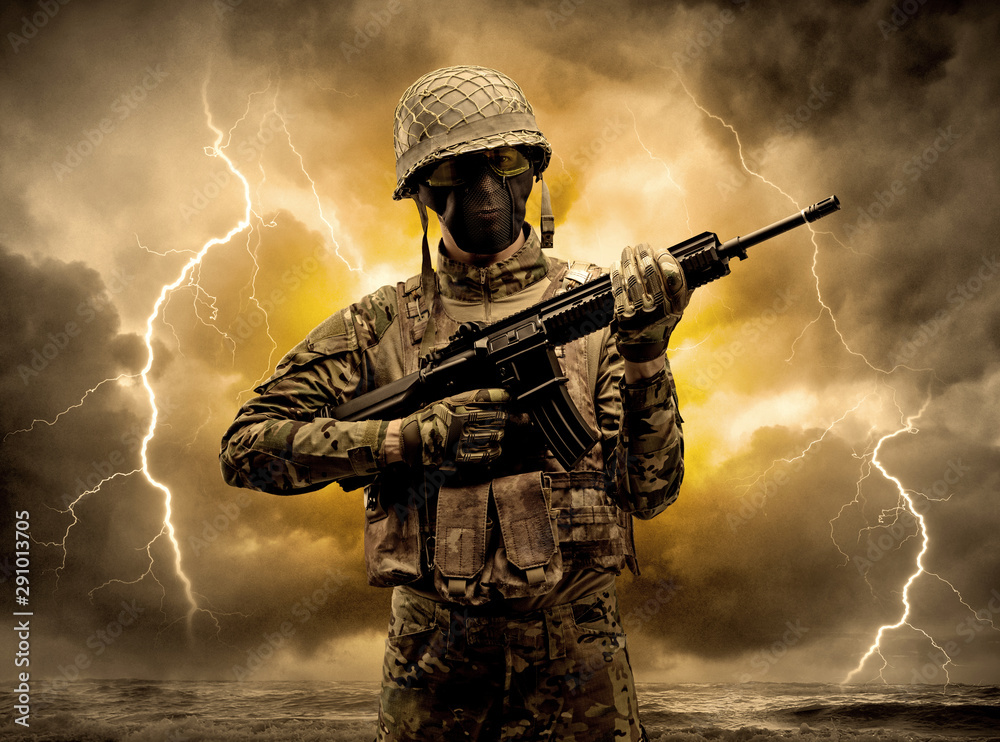 Armed soldier standing in rainy obscure weather Armed soldier standing in rainy obscure weather
