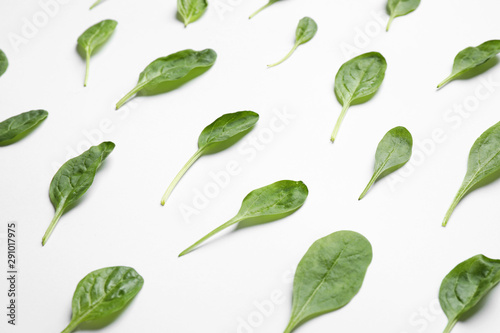 Fresh green healthy spinach on white background