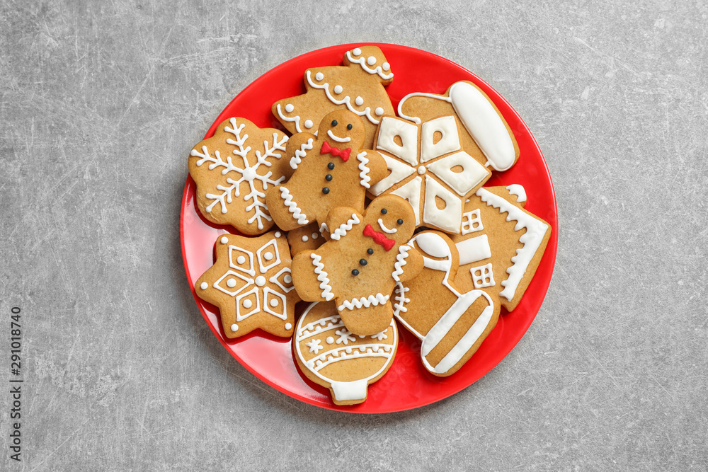 Tasty homemade Christmas cookies on grey table, top view