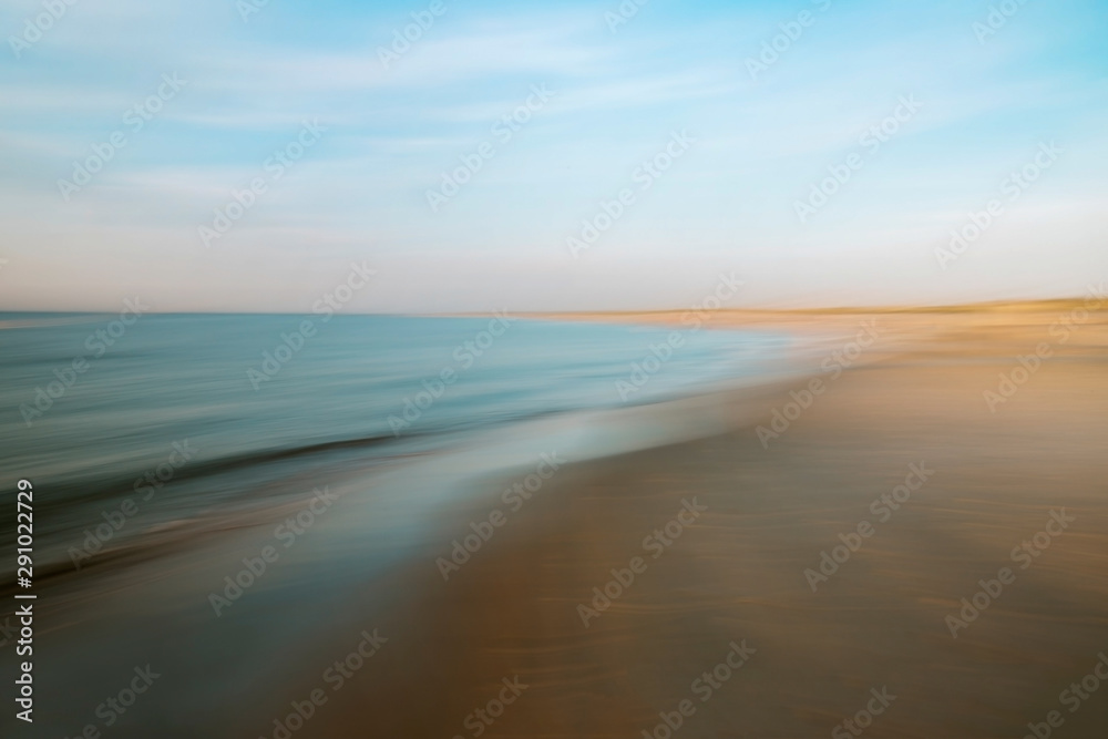 Scenic View of Ocean Shoreline at Sunset - obrazy, fototapety, plakaty 
