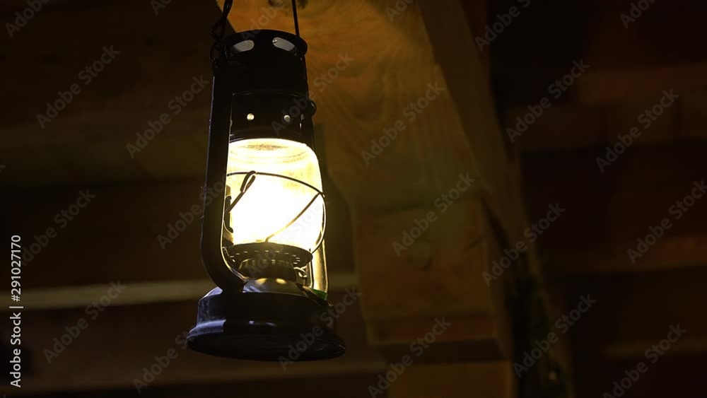 old lantern hanging from the ceiling, Lamp kerosene lantern fire old, Oil lamp lit in the darkness