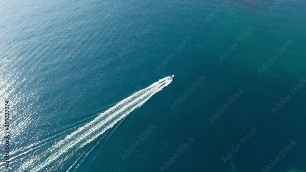 drone aerial video footage of speed boat running over sea near Mallorca island