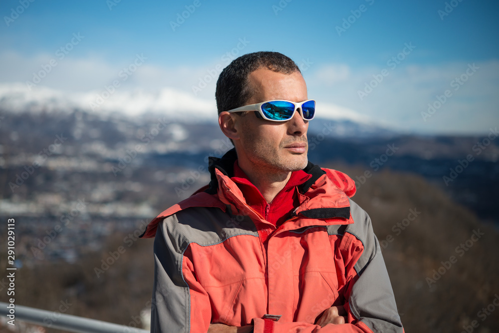 man with sunglasses on the mountains in a beautiful sunny day man with sunglasses on the mountains in a beautiful sunny day