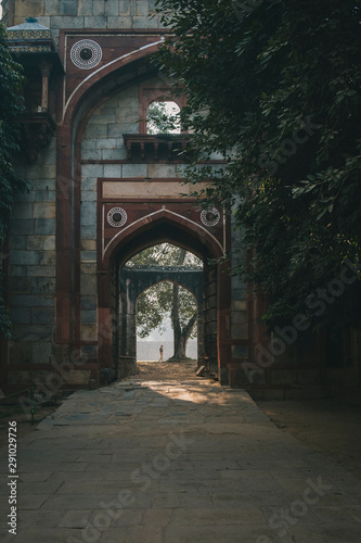 Indian guard at Qutb Minar complex during sunrise, New Delhi, India photo