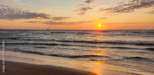 Beautiful panorama image of setting sun over the North Sea  © Menyhert