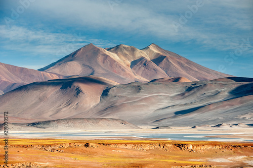 Pideras Rojas (Red Rocks) Atacama Desert. Salt lagunas and volcanos and red rocks southern from San Pedro de Atacama. Stunning scenery in evening sunlight at Atacama desert, Chile, South America photo
