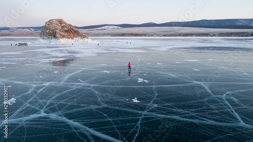 Bilde på lerret woman skating on the frozen baikal lake
