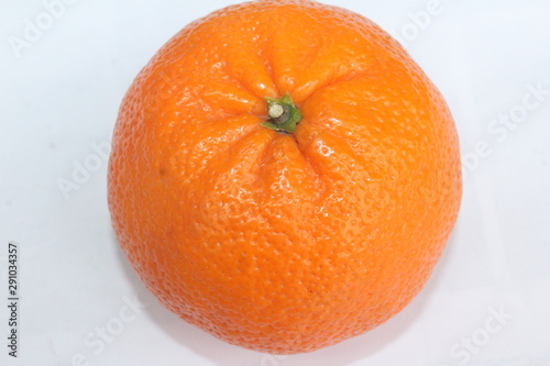 Pomegranate with banana and orange on white background