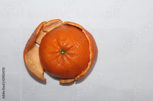 Pomegranate with banana and orange on white background