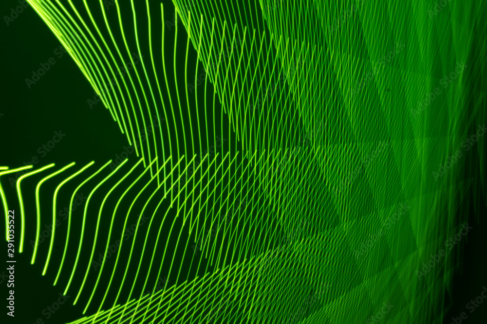 abstract long exposure blurred light lines black and green background. Geometric shapes