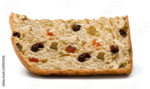 A slice of panettone, an Italian type of sweet bread loaf, with candied fruits and raisins, usually prepared and enjoyed for Christmas and New Year. On a white background ready to be used