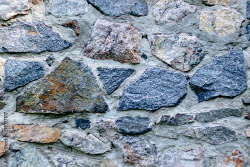 Fragment of a wall from a chipped stone for background