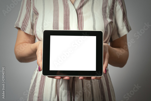 Blank screeb tablet computer in business woman hands. photo
