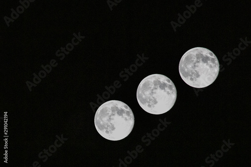 A multiple exposure image of the full moon captured in Colorado. photo