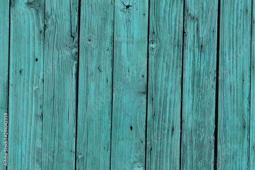 wooden planks surface covered with bright turquoise paint