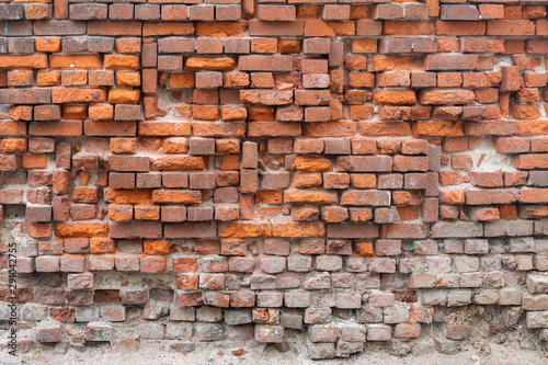 Crumbling Red Brick Wall