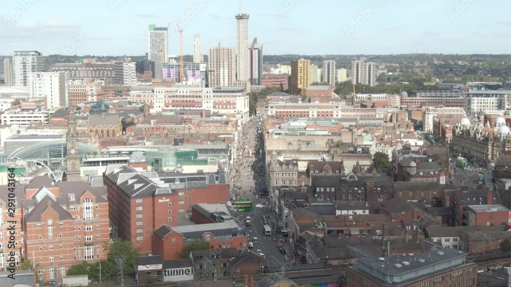 People shopping on a sunny day on Briggate. Aerial Drone Leeds City Centre, West Yorkshire People shopping on a sunny day on Briggate. Aerial Drone Leeds City Centre, West Yorkshire