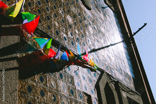 Colorful garland string of flags with wind and blue sky 