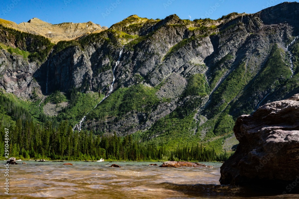 lake and waterfalls in mountains