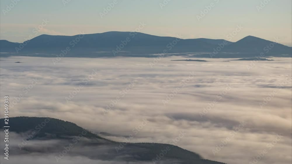 Mountain time lapse in the waves of fog Mountain time lapse in the waves of fog