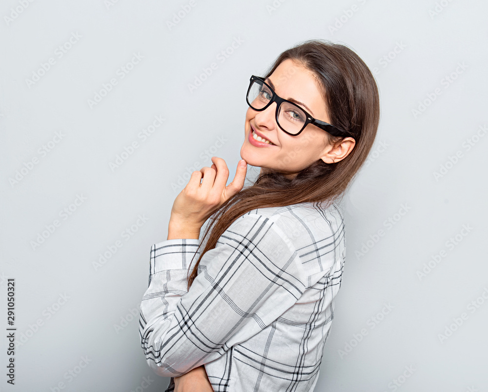 Beautiful smiling positive successful business woman in glasses looking confidently in white shirt and long hair. Closeup Beautiful smiling positive successful business woman in glasses looking confidently in white shirt and long hair. Closeup