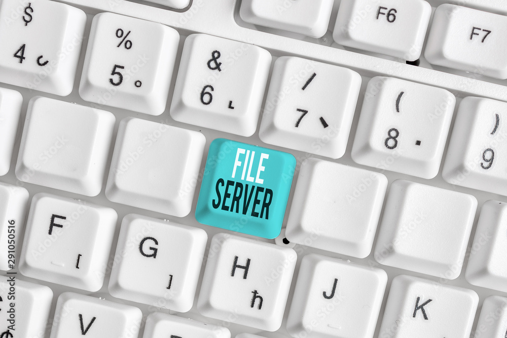 Writing note showing File Server. Business concept for device which controls access to separately stored data White pc keyboard with note paper above the white background Writing note showing File Server. Business concept for device which controls access to separately stored data White pc keyboard with note paper above the white background