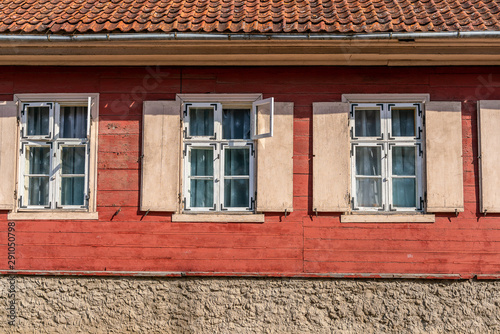 Red Facade of an old wooden one-story building