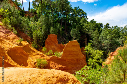 Large colorful ochre deposits, located in Roussillon, small Provensal town in  Natural Regional Park of Luberon, South of France photo