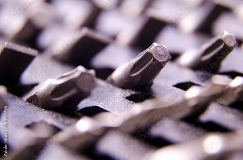 close up macro photo or photography of a set tool bits of torque bits with blured bokeh effect