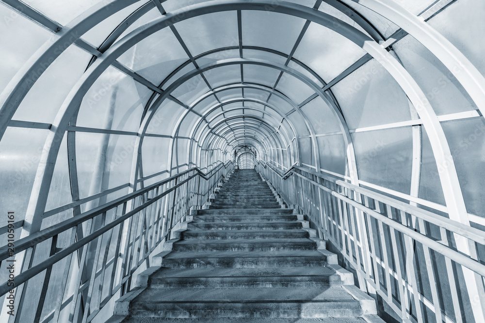 Stairs to the metal and glass corridor above the highway. Stairs to the metal and glass corridor above the highway.
