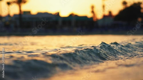 Beautiful scenery view of waving sea water with beautiful sunset light on blur background. Traveling business, resting weekend. Summer vacations abroad. Panoramic coastline. Nature power. photo