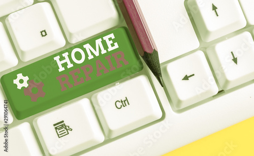 Conceptual hand writing showing Home Repair. Concept meaning maintenance or improving your own house by yourself using tools White pc keyboard with note paper above the white background photo