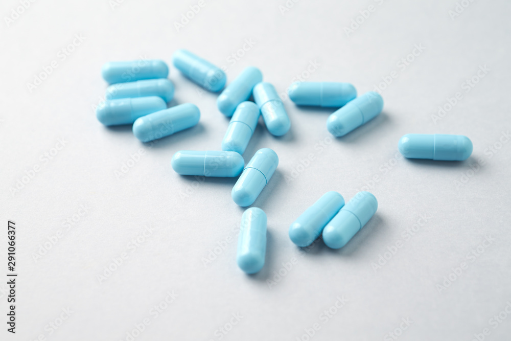 Calcium capsules. Bright background. Close up. Copy space. 