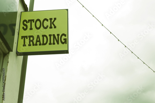 Word writing text Stock Trading. Business photo showcasing Buy and Sell of Securities Electronically on the Exchange Floor Green ad board on the street with copy space for advertisement photo