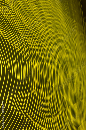 abstract long exposure blurred light lines black and yellow background. Geometric shapes