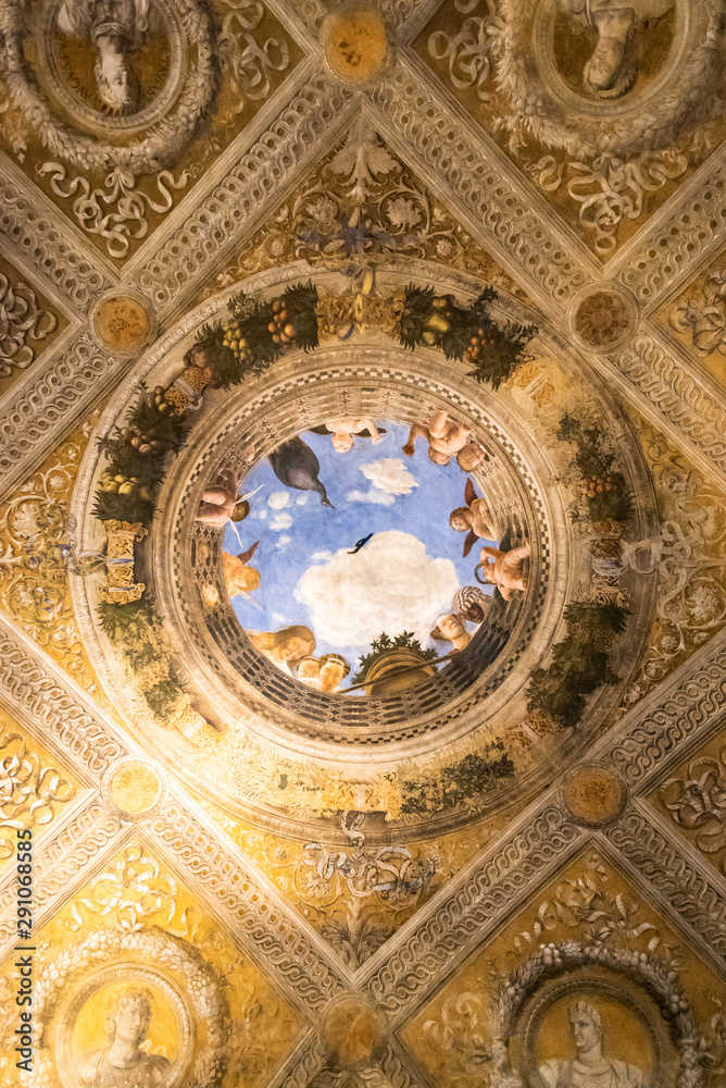 3D effect of illustration decorating the center of luxurious ceiling inside medieval palace in Italy