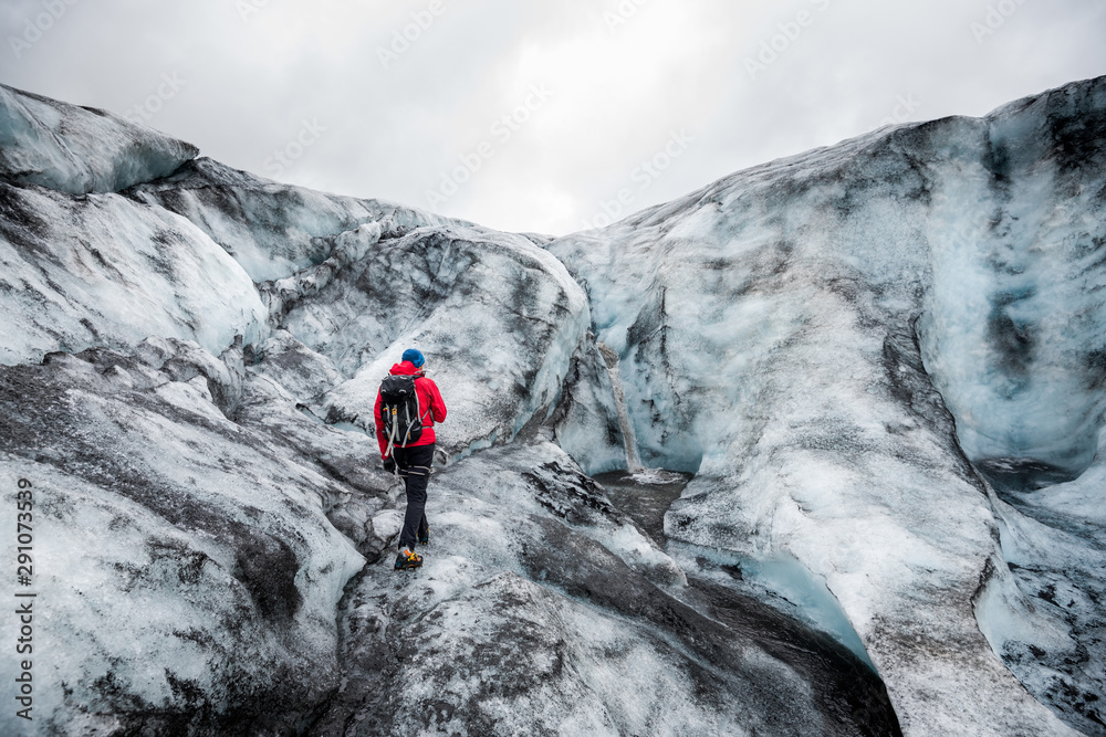 People hike in a glacier