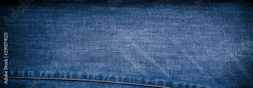 Retro color tone of blue denim jeans fabric texture for background website fashion design or backdrop product.