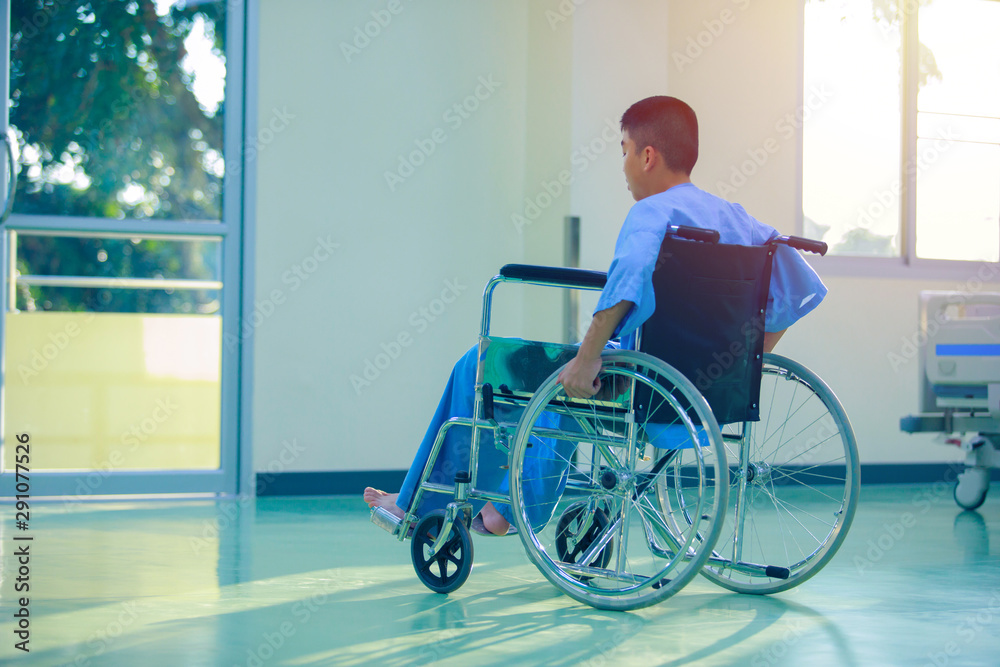 The patients on the wheelchair in the hospital and clean bed background, the patients with modern medical equipment in the hospital The patients on the wheelchair in the hospital and clean bed background, the patients with modern medical equipment in the hospital