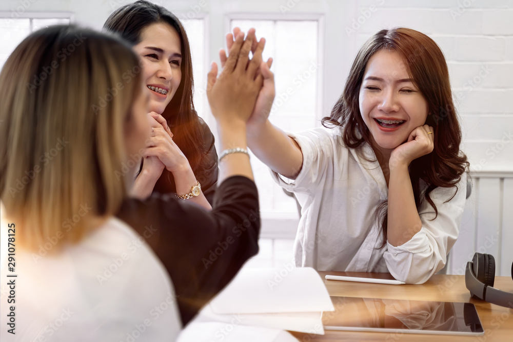 Successful asian university students teamwork giving high five. education, school, teamwork and people concept Successful asian university students teamwork giving high five. education, school, teamwork and people concept