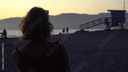 Beautiful Woman Walking Toward a Lifeguard Tower, Slow Motion